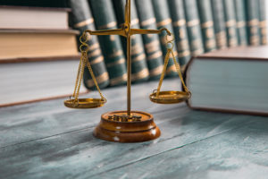 Justice Scales And Books On Table