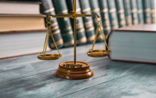 Justice Scales And Books On Table